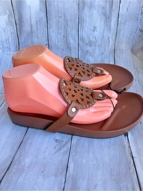 Dolce Vita Pandora footbed sandals featuring a medallion cutout detail.